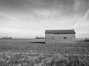 House on field against sky