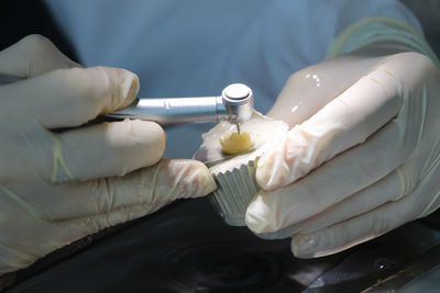 Cropped image of woman working on table in hospital