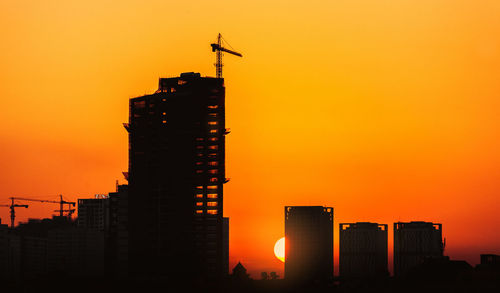 Silhouette of city during sunset