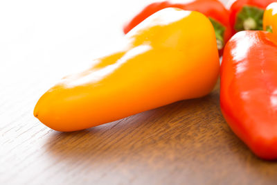 Close-up of orange bell peppers on table