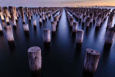 Panoramic view of wooden pier posts in row, princes pier, melbourne