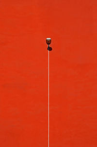 Street light on red wall