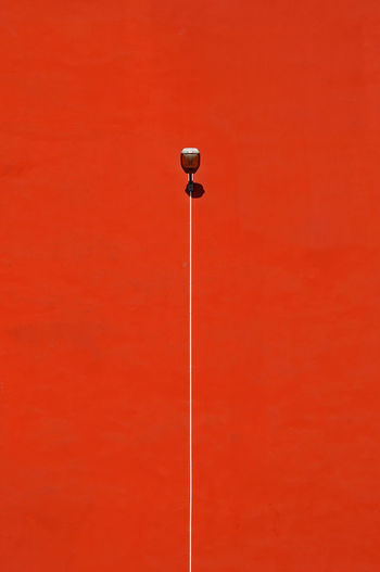 Street light on red wall