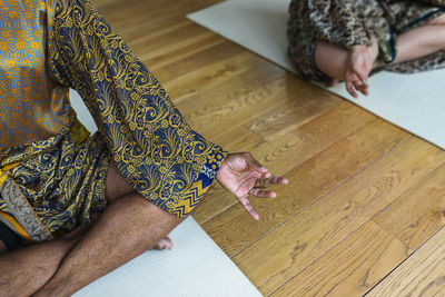 Low section of man meditating