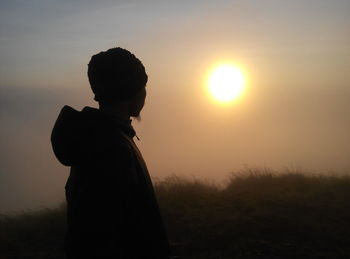 Silhouette of man at sunset