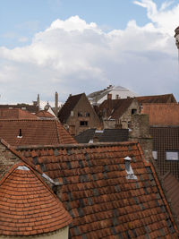 Houses in town against sky
