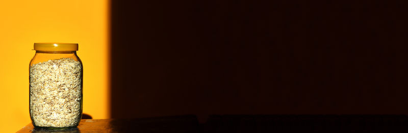 Close-up of bottles against black background