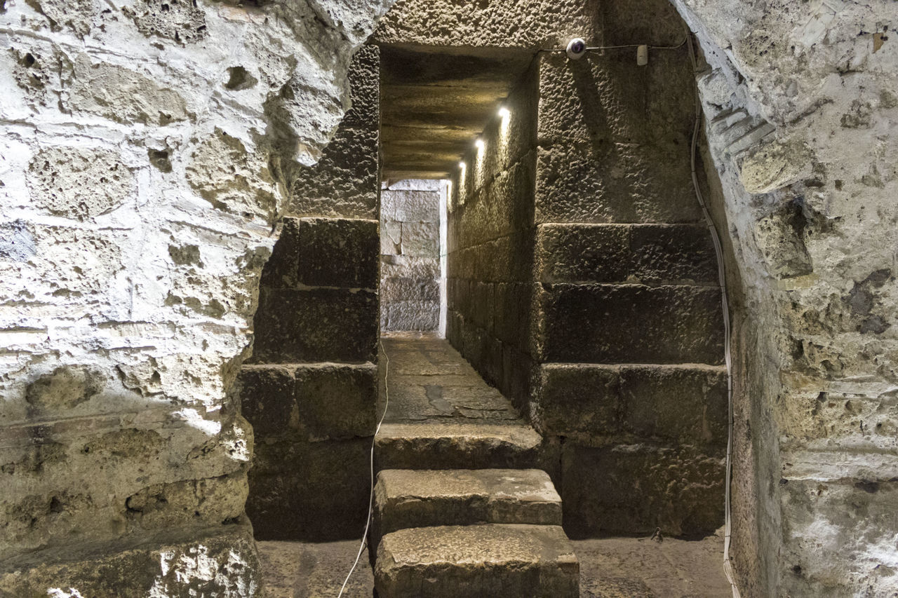 STONE WALL OF OLD STAIRCASE IN BUILDING