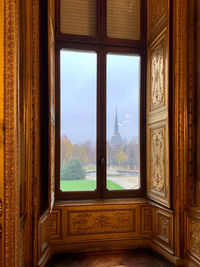 Trees seen through window of the palace.