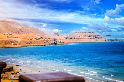 View of beach against cloudy sky