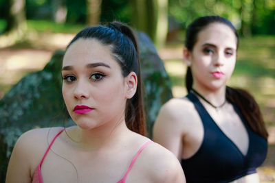 Portrait of young female friends at park