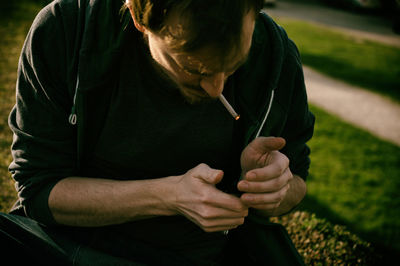 Midsection of man wearing mask