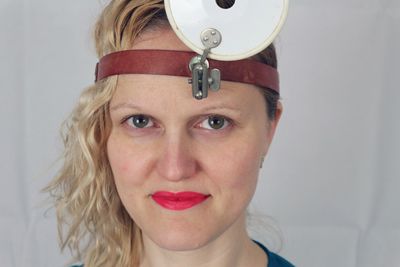 Close-up portrait of woman wearing equipment