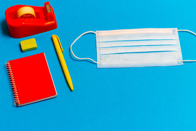 High angle view of books on blue table