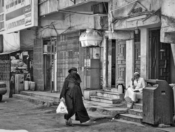 People outside temple in city