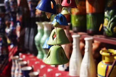 Close-up of colorful decorations hanging for sale at market