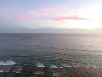 Scenic view of sea against sky at sunset