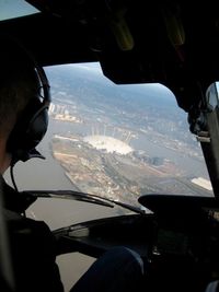 Man seen through airplane window