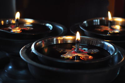 Close-up of burning tea light candles