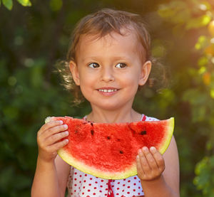 Portrait of smiling girl holding ice cream