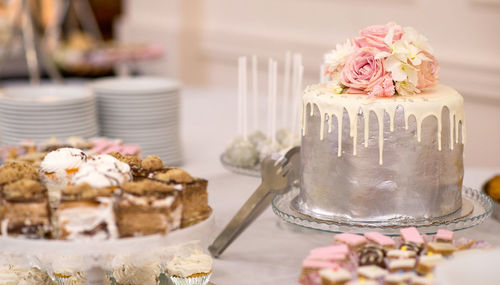 Close-up of pink roses on table