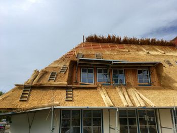 Low angle view of old building against sky