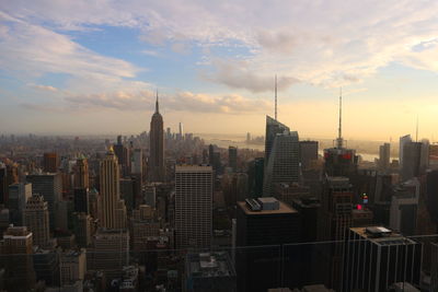 New york skylines with cloudy sky. taken from rockefeller center, view towards south manhattan.