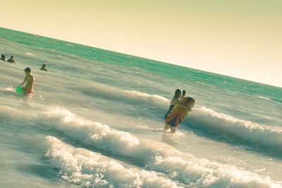 People enjoying at beach