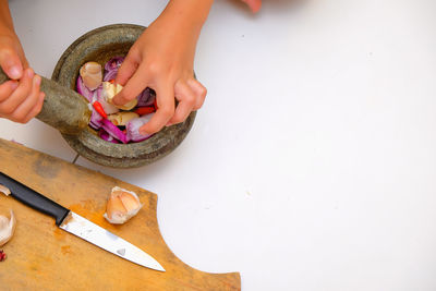 High angle view of person preparing food on table