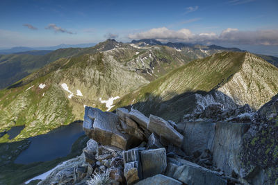 Scenic view of rocks in mountains against sky