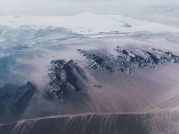 Aerial view of snow covered land