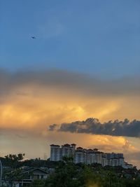 View of buildings against sky during sunset