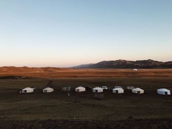 Scenic view of field against clear sky