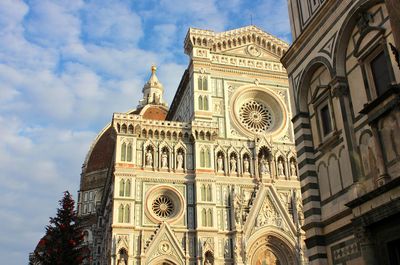 Low angle view of cathedral against cloudy sky