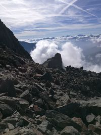 Scenic view of mountains against cloudy sky