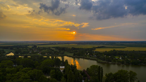 Scenic view of landscape against sky during sunset