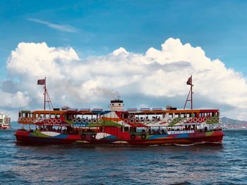 Ship sailing on sea against sky