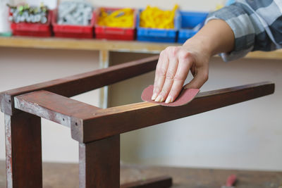 Close-up of hand on table