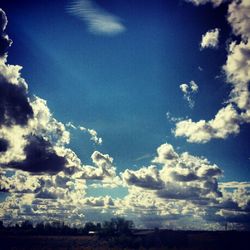 Scenic view of landscape against cloudy sky