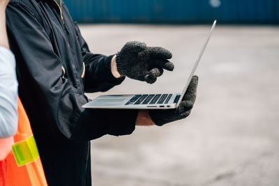 Side view of man using mobile phone