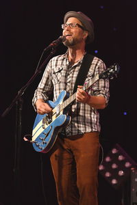 Full length of man holding guitar