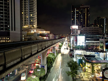 High angle view of city street and buildings at night