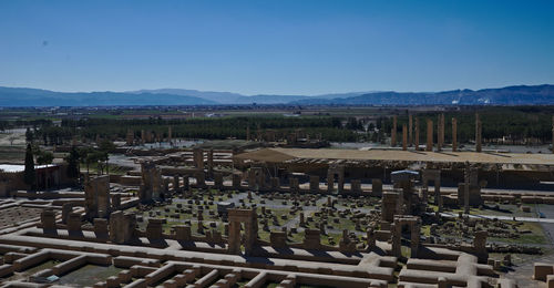 High angle view of landscape against clear blue sky