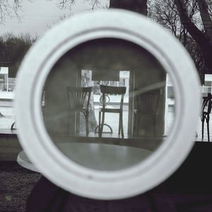 Reflection of man standing on glass