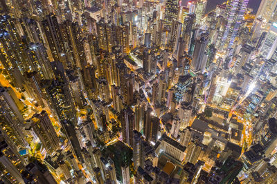 High angle view of city lit up at night