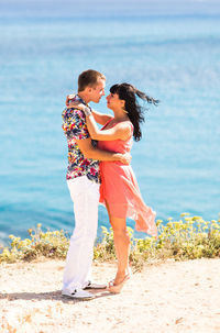 Couple standing on beach