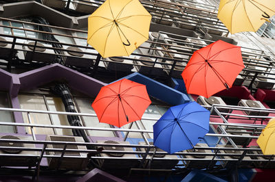 Low angle view of multi colored umbrellas hanging