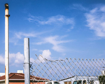 Low angle view of metal structure against sky