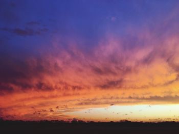 Low angle view of dramatic sky during sunset