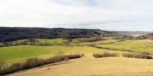 Scenic view of agricultural field against sky